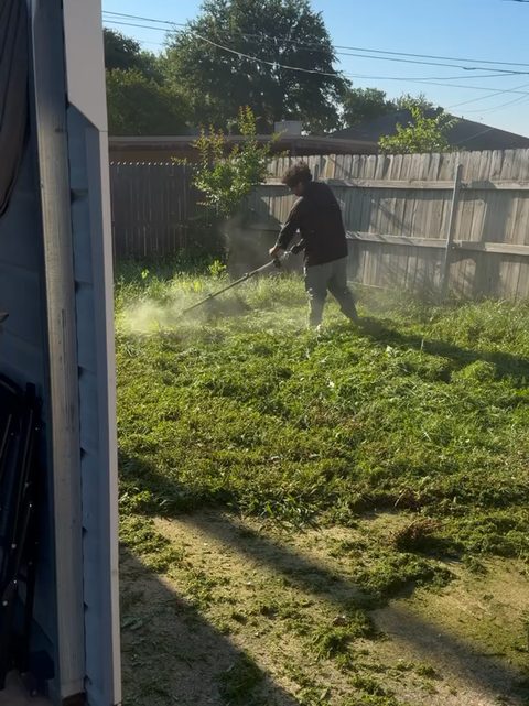 Trimming overgrown grass